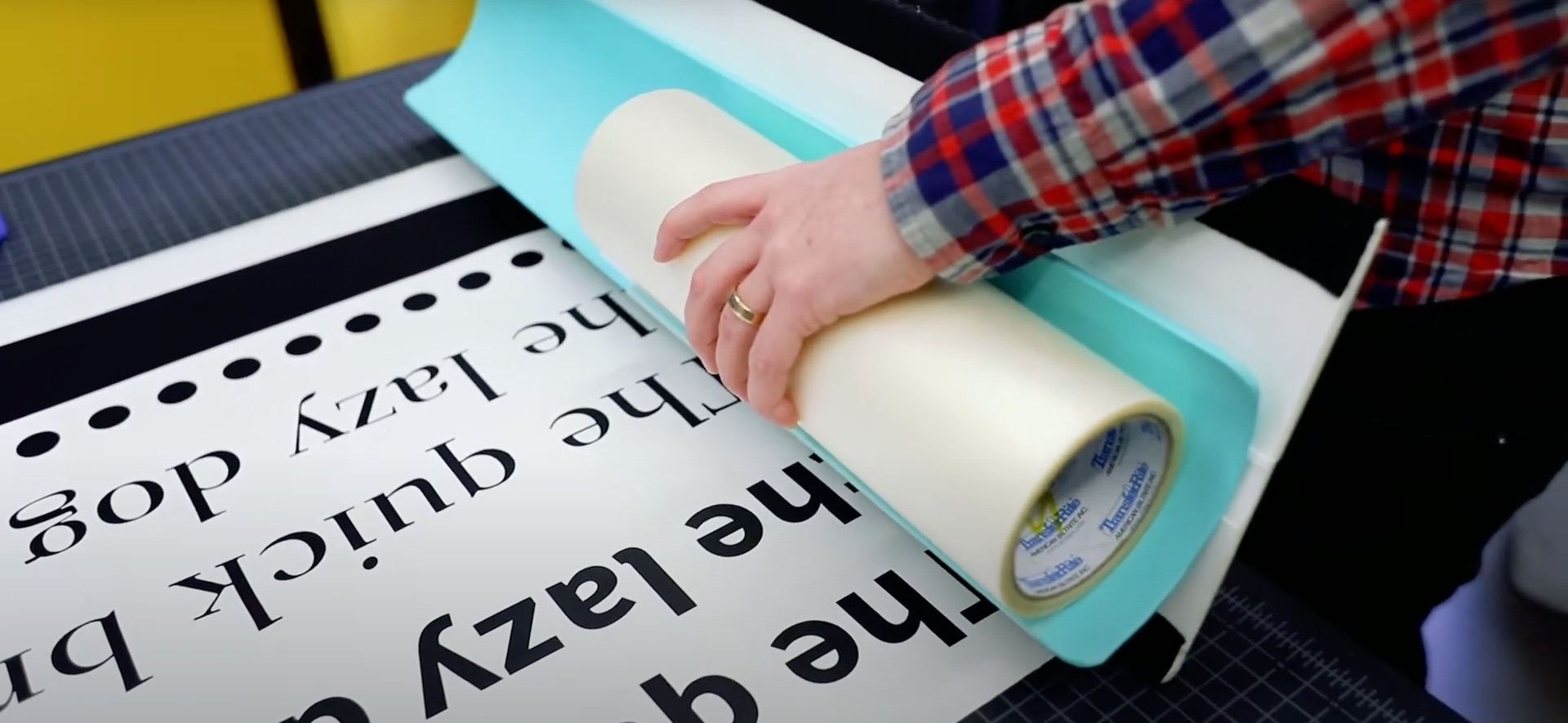 person demonstrating how cutting vinyl works